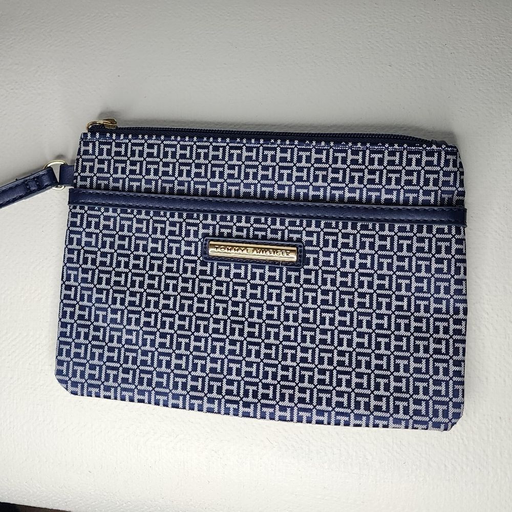 Tommy Hilfiger Wristlet Blue And White with red accents.